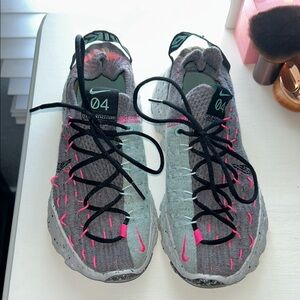 Nike Women’s Gray Sneakers with Pink Accents